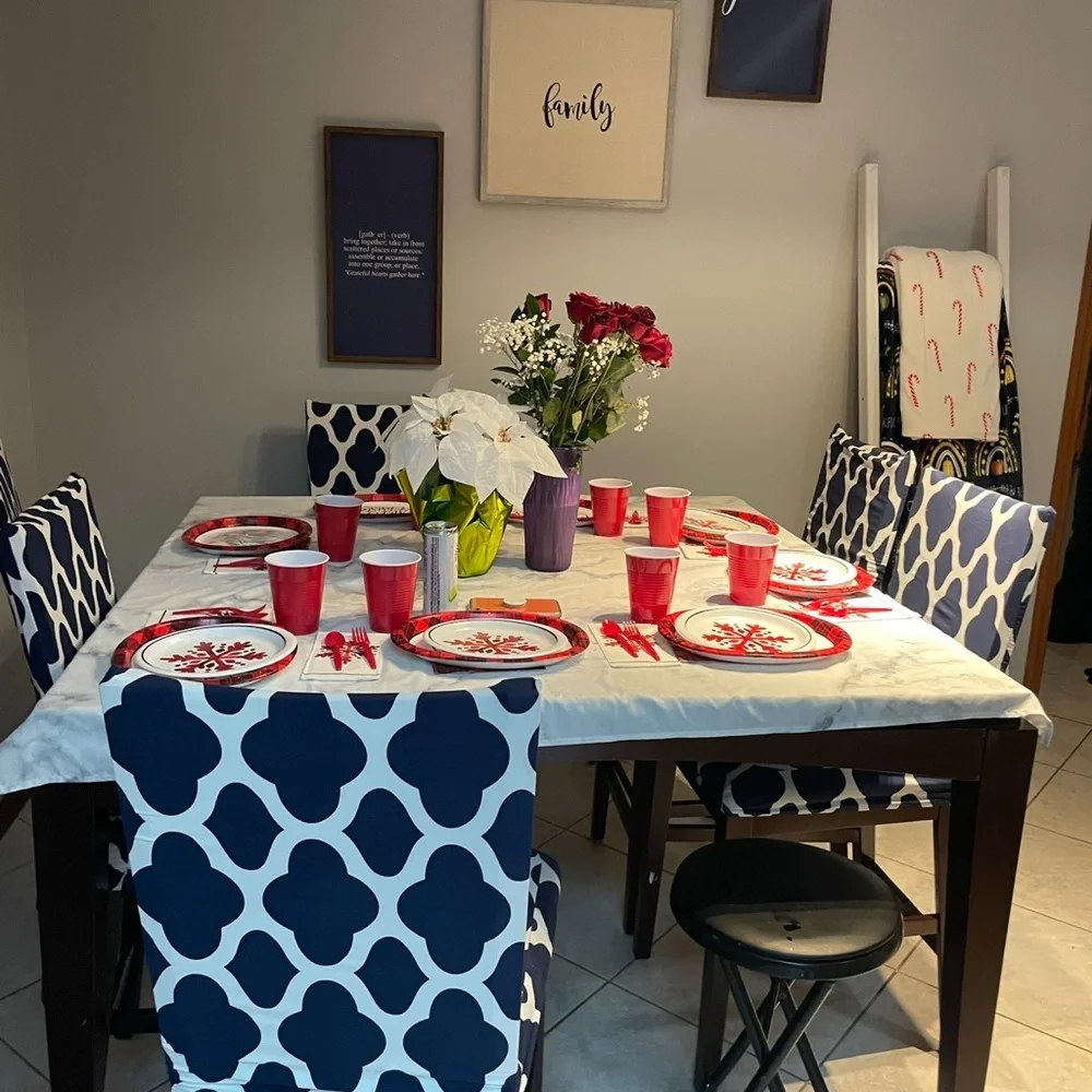 6 chair covers, white and blue with designs.